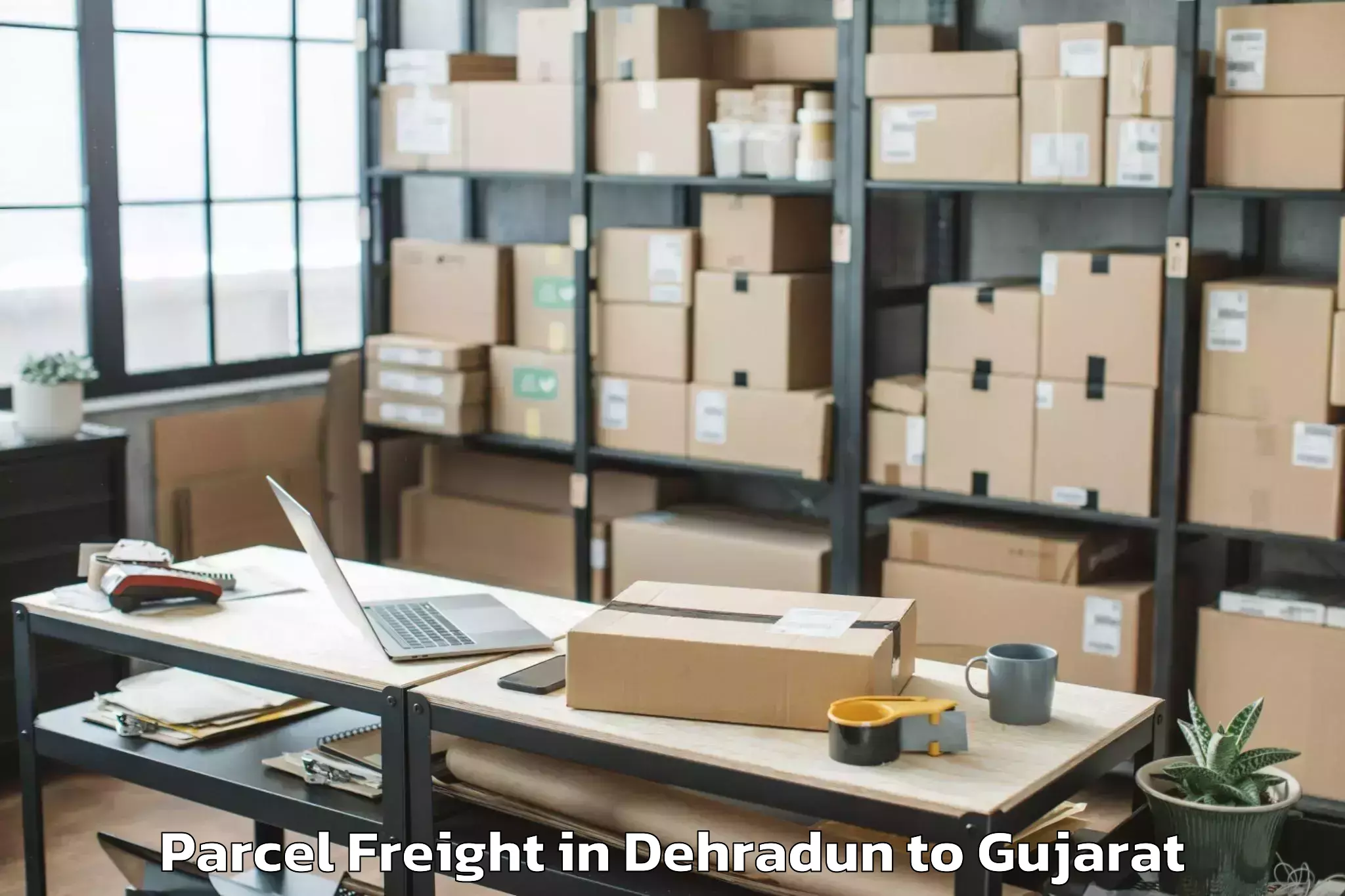 Reliable Dehradun to Gls University Ahmedabad Parcel Freight